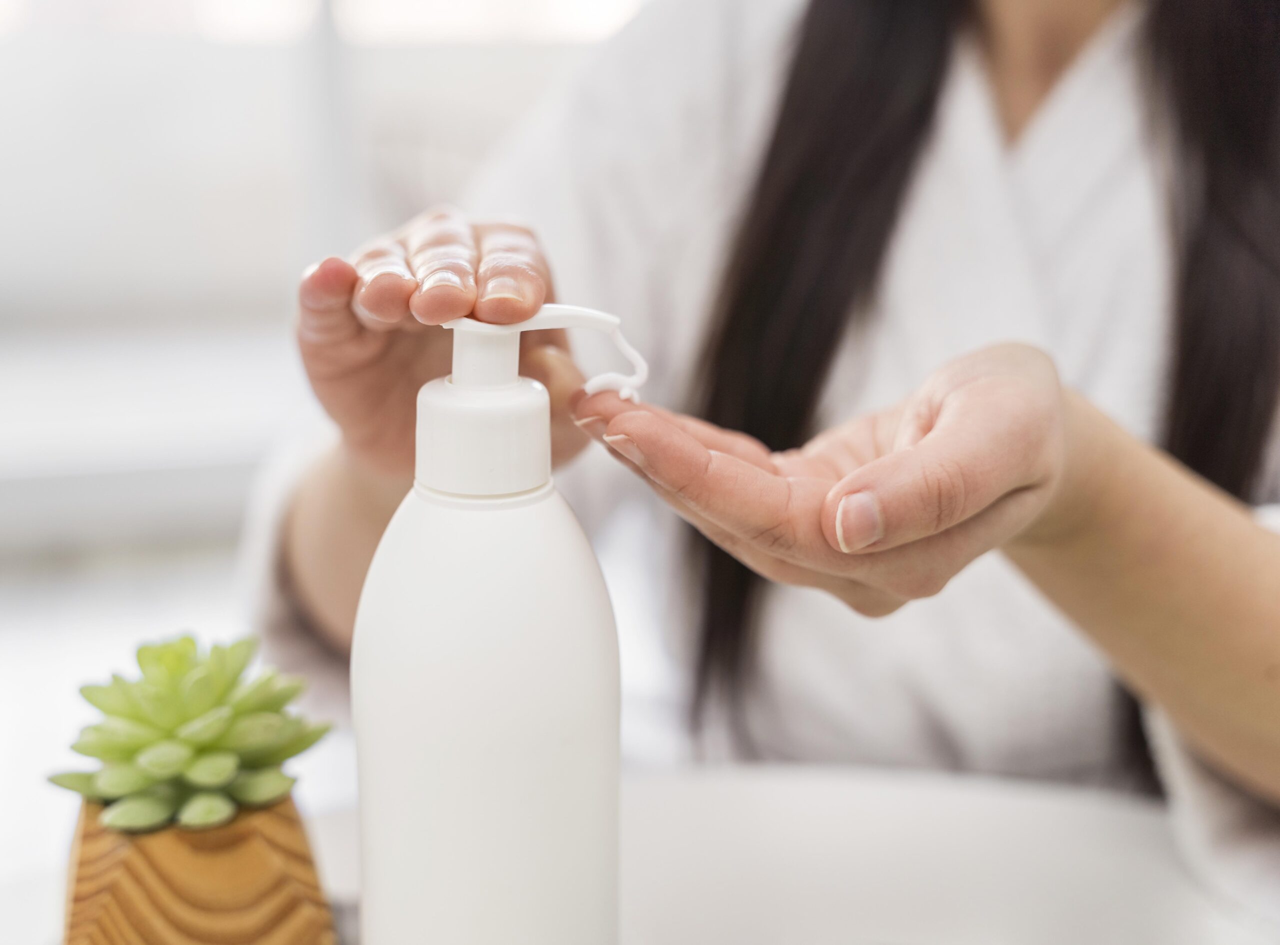 close-up-woman-pouring-hand-cream